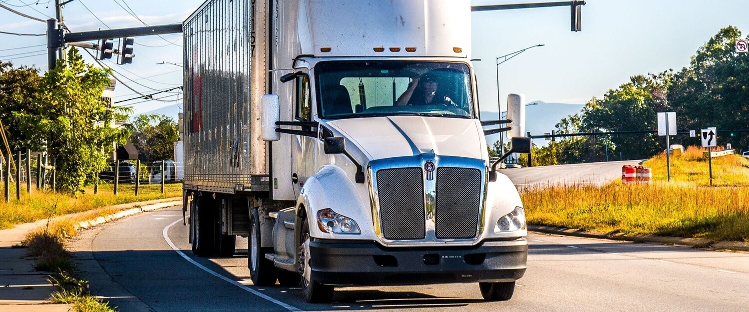 Semi truck on the road in Omaha, representing CDL drivers getting a DOT physical at One80 Chiropractic